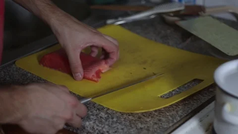 Man cuts fish in the kitchen Stock Footage 118069220