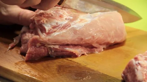 Man cuts fresh meat Video stock 76475613