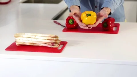 Man cuts fresh spring peppers Stock Footage 109398562