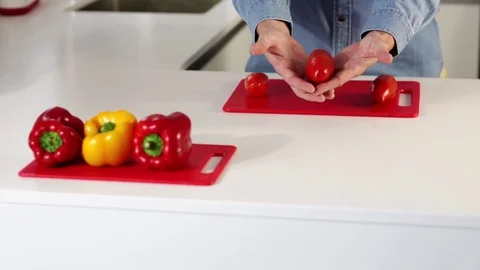 Man cuts fresh spring tomatos Stock Footage 109398633