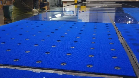 A man cuts the glass on the table.In the hand glass cutter.Shatters the glass. Stock-Footage 122808868