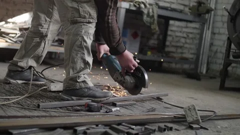 Man cuts grinder Stock Footage 130710533