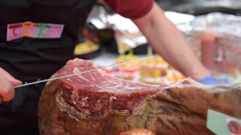 Man cuts ham Stock Footage 91574929