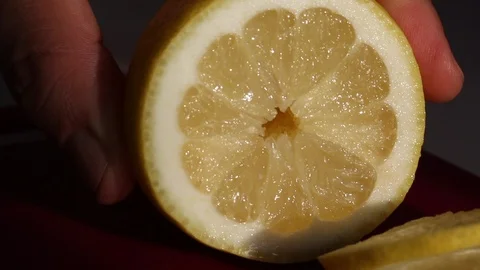The man cuts the lemon rings and puts the knife aside. Lemon fresh and juicy. Stock Footage 109421084
