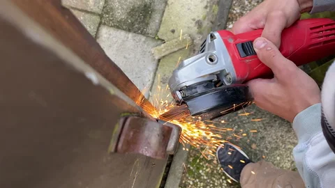 Man cuts of the lock on the door with a grinder. Grinder sparks Stock Footage 164150363