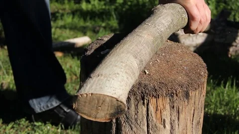 The man cuts the log Stock Footage 76738627