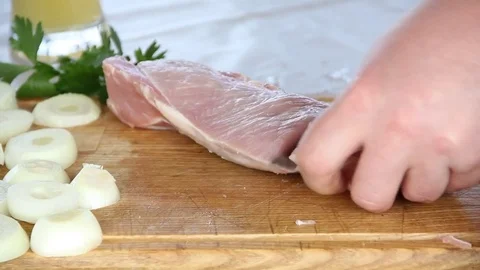 Man cuts meat Stock Footage 75609709