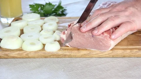 Man cuts meat Video stock 75609832