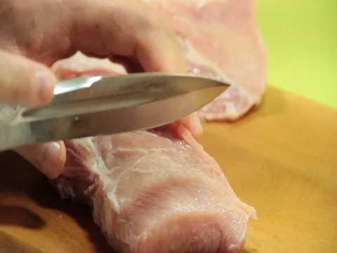 The man cuts the meat of the hand Video stock 79056325