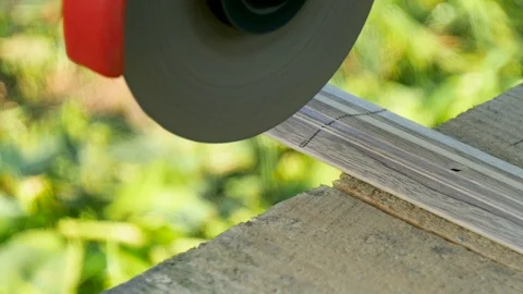Man cuts metal threshold for a door by grinder Video stock 77337349