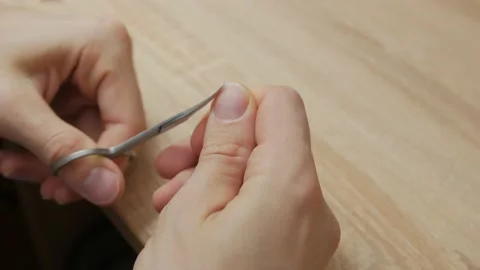 Man Cuts Nail Stock Footage 144568739