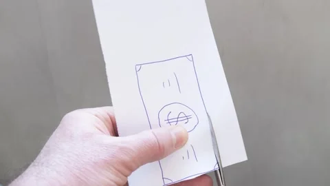 Man cuts out drawn dollar with scissors. Concept of money depreciation due .. Stock Footage 296477824