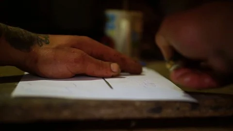 Man cuts out a template for drawing Stock-Footage 80931245