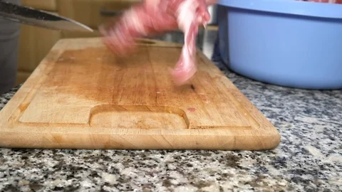 A man cuts the pork Stock Footage 101201124