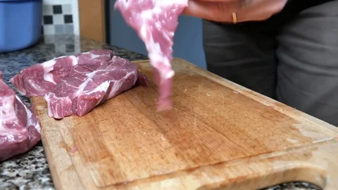 A man cuts the pork Stock Footage 101201909