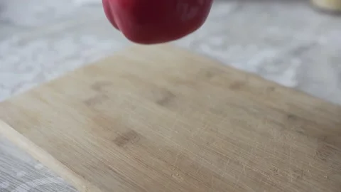 Man cuts red pepper with knife Stock Footage 131985280