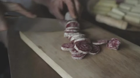Man cuts a salami 스톡 동영상 134261558
