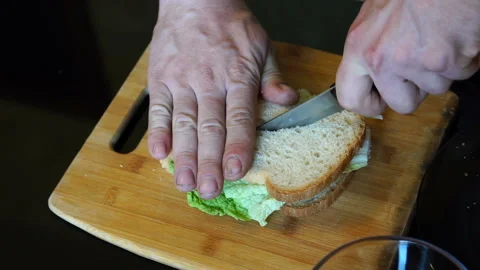 Man cuts a sandwich close up Stock Footage 112686432