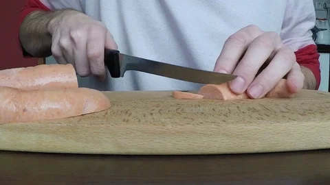 Man cuts the sausage Stock-Footage 70207895