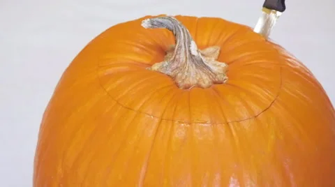 Man Cuts Top Off Pumpkin in Slow Motion Stock Footage 68752719