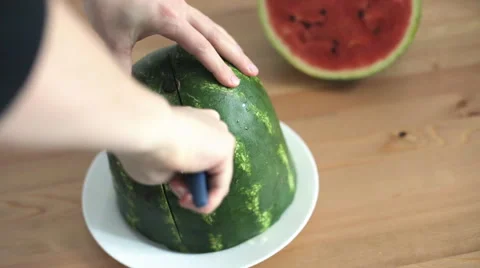 Man cuts watermelon 스톡 동영상 68614210