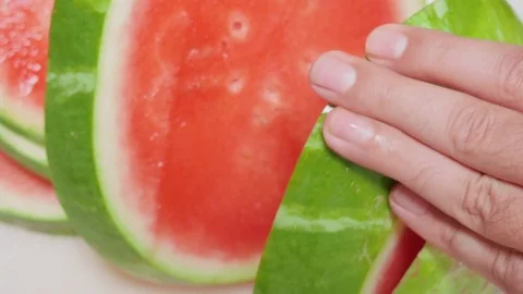 Man Cuts Watermelon into Rings Stock Footage 79050781