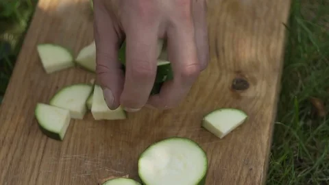 Man cuts zucchini carefully hd 動画素材 80243283