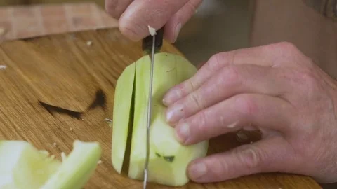 The man cuts the zucchini close up Stock Footage 80101971
