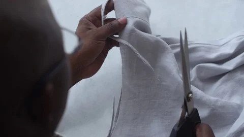 Man Cutting and Sewing Video stock 104900534