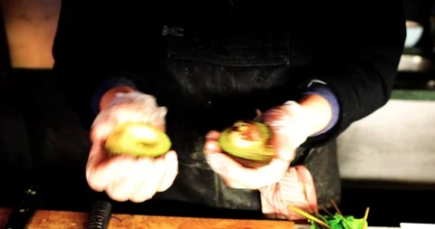Man Cutting Avocado Stock Footage 105650339