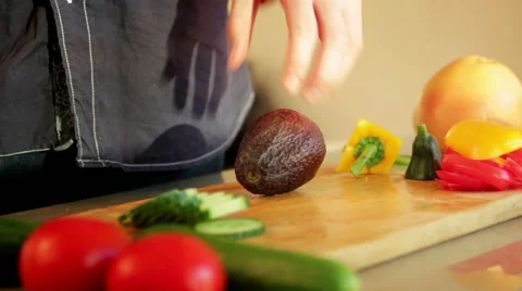 Man cutting avocado in half Stock Footage 41013886