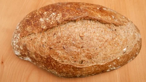 Man cutting black bread. Stock Footage 71914150