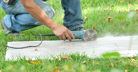 Man cutting board with grinder Stock Footage 80669893