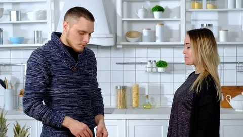 Man on a cutting board slices pineapple into circles Видео 127291244