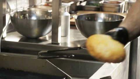 Man Cutting Bread Roll Stock Footage 71565757