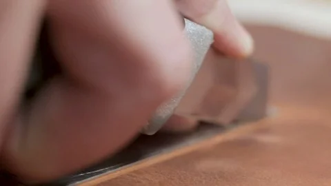Man cutting the brown leather for wallet. Close-up showing hands of master an 스톡 동영상 82055949