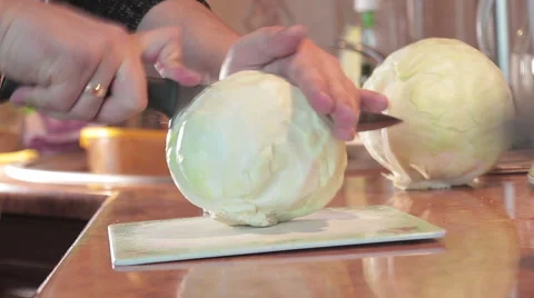 Man cutting cabbage Stock Footage 61492891