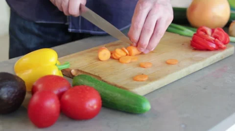 Man is cutting a carrot Stock Footage 41012044