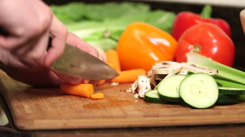 Man cutting carrots close up Stock Footage 61393866