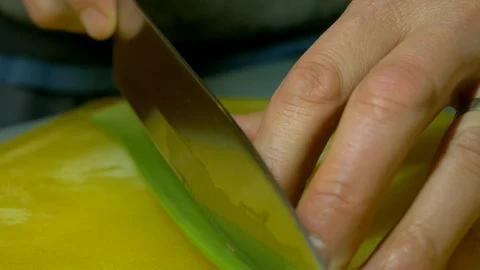 Man cutting celery length ways with a knife Stockbeeldmateriaal 93433785