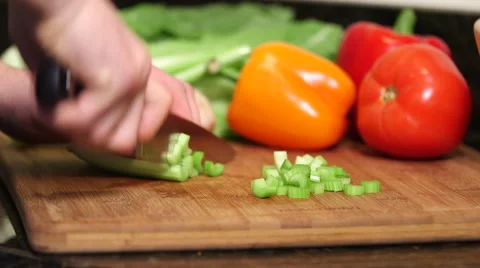 Man cutting celery stalks close up Stock Footage 61393906