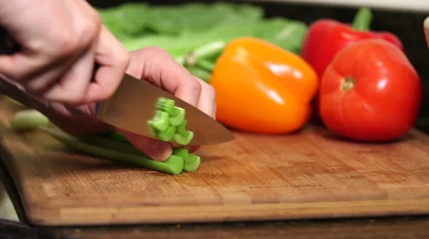 Man cutting celery stalks close up Stock Footage 61394782