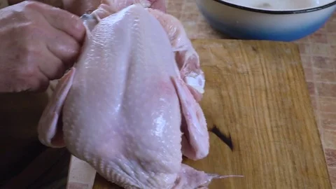 The man is cutting the chicken hd Video stock 80093632