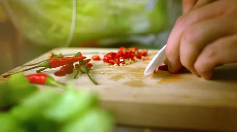 Man Cutting Chili on Cutting Board with Ceramic White Knife - Color Graded Cl Stock Footage 59853764