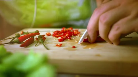 Man Cutting Chili on Cutting Board with Ceramic White Knife - Color Graded Cl Stock Footage 59853882