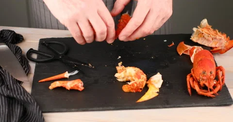 Man cutting the claw of lobster Stock Footage 104702322