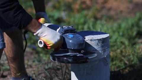 Man cutting concrete column. concrete dust. Stock Footage 72598230