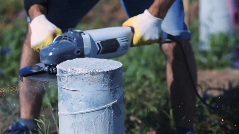 Man cutting concrete column. Construction Video stock 72598075