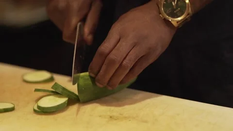 Man Cutting Cucumber (120fps) 스톡 동영상 154145576
