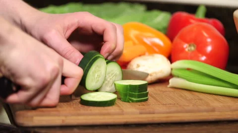 Man cutting cucumber close up Video stock 61396024